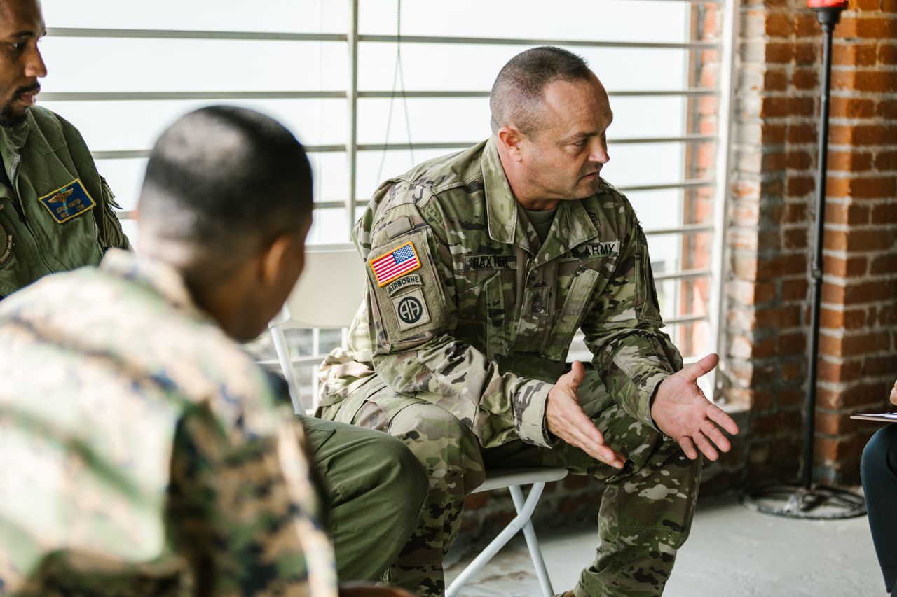 Soldier gestures while leading group discussion